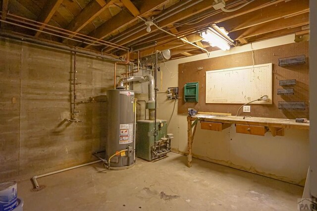 utilities featuring gas water heater and a heating unit