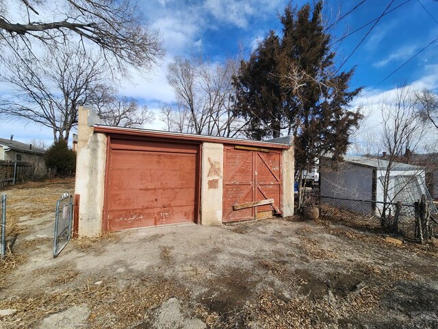 garage with fence