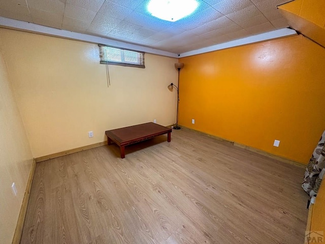 620 S 7th St, Springfield, CO 81073 - below grade area featuring wood finished floors and a drop ceiling