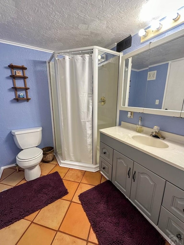 620 S 7th St, Springfield, CO 81073 - full bath featuring a shower stall, vanity, a textured ceiling, and tile patterned flooring
