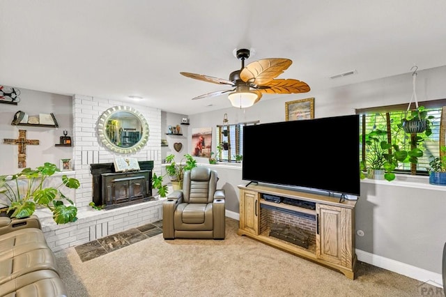 living room with a brick fireplace, baseboards, visible vents, and light colored carpet