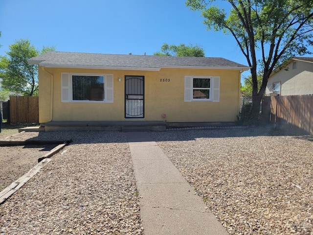 2505 NW Denver Blvd, Pueblo, CO 81003 - bungalow with stucco siding and fence