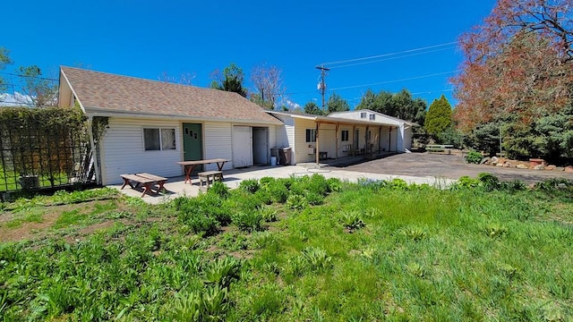 back of property featuring a patio