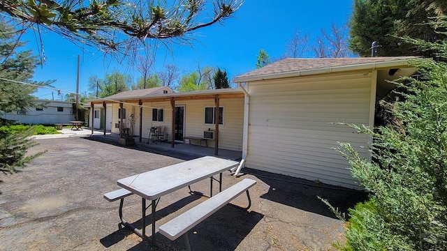 back of house with a patio