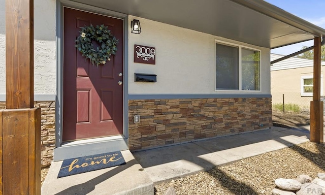 3009 Baystate Ave, Pueblo, CO 81005 - property entrance featuring stone siding and stucco siding