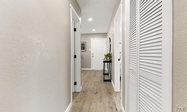 3009 Baystate Ave, Pueblo, CO 81005 - hall with light wood-style flooring, recessed lighting, a textured wall, and baseboards