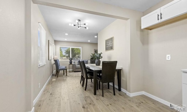 3009 Baystate Ave, Pueblo, CO 81005 - dining room with light wood finished floors, baseboards, recessed lighting, and a chandelier