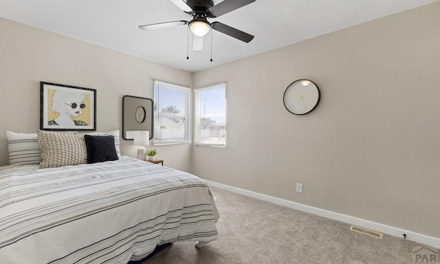 3009 Baystate Ave, Pueblo, CO 81005 - bedroom featuring carpet floors, baseboards, and a ceiling fan