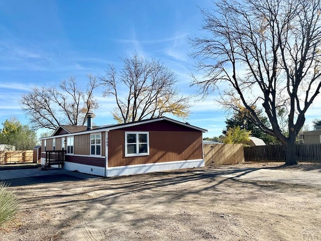 view of property exterior featuring fence