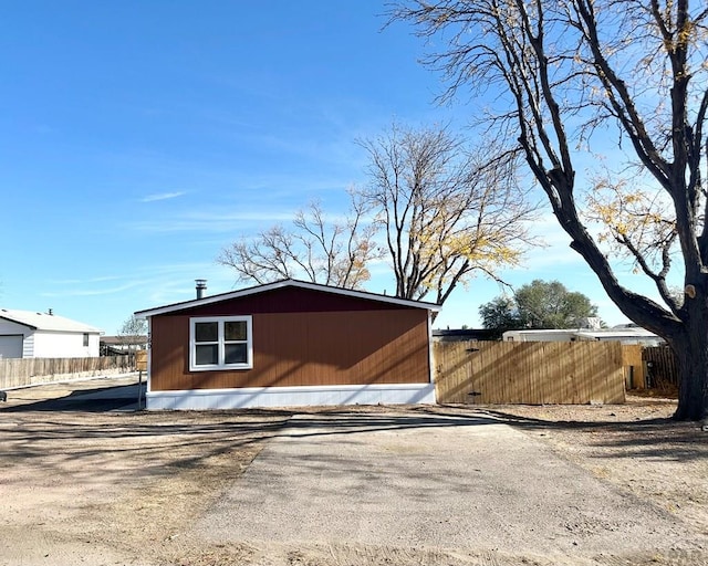 view of home's exterior with fence