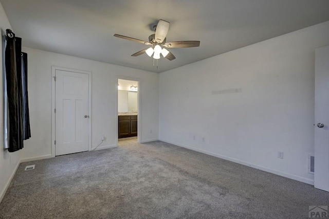 unfurnished bedroom featuring visible vents, light carpet, ceiling fan, ensuite bath, and baseboards