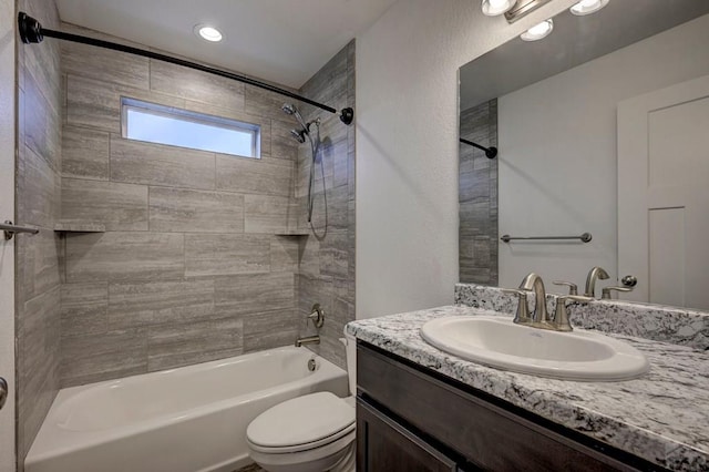 bathroom with  shower combination, vanity, and toilet