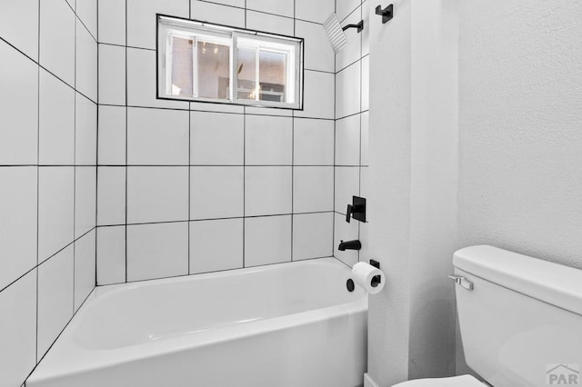 full bath featuring toilet and bathing tub / shower combination