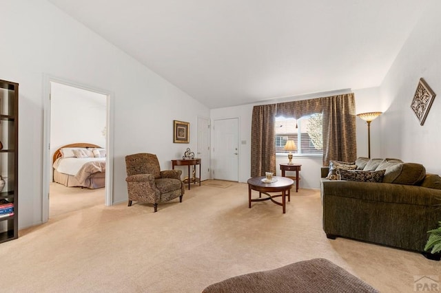 2106 Chatalet Ln Unit I, Pueblo, CO 81005 - living area with light colored carpet and vaulted ceiling