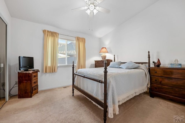 2106 Chatalet Ln Unit I, Pueblo, CO 81005 - bedroom featuring carpet flooring, vaulted ceiling, and a ceiling fan