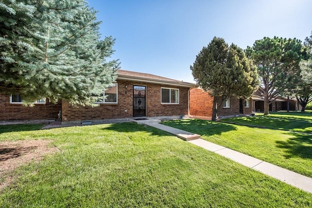 2106 Chatalet Ln Unit I, Pueblo, CO 81005 - single story home featuring a front lawn and brick siding