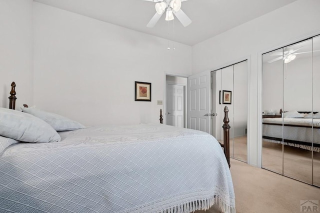 2106 Chatalet Ln Unit I, Pueblo, CO 81005 - bedroom with two closets, light colored carpet, and ceiling fan