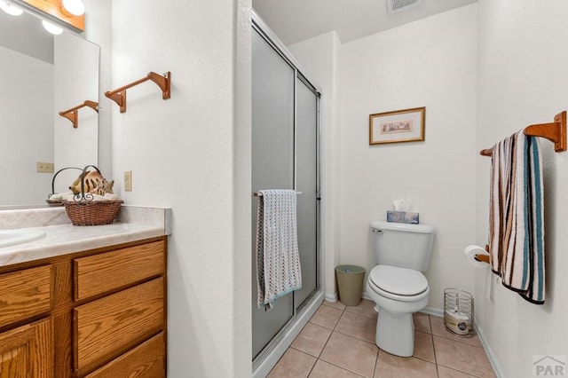 2106 Chatalet Ln Unit I, Pueblo, CO 81005 - bathroom with a stall shower, tile patterned floors, and vanity
