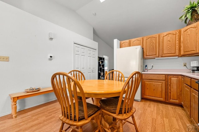 2106 Chatalet Ln Unit I, Pueblo, CO 81005 - dining space with vaulted ceiling and light wood-type flooring