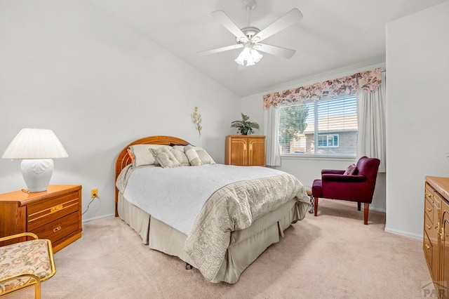 2106 Chatalet Ln Unit I, Pueblo, CO 81005 - bedroom featuring light carpet, vaulted ceiling, and a ceiling fan