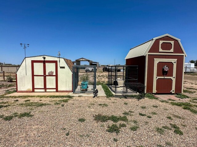 view of poultry coop featuring fence