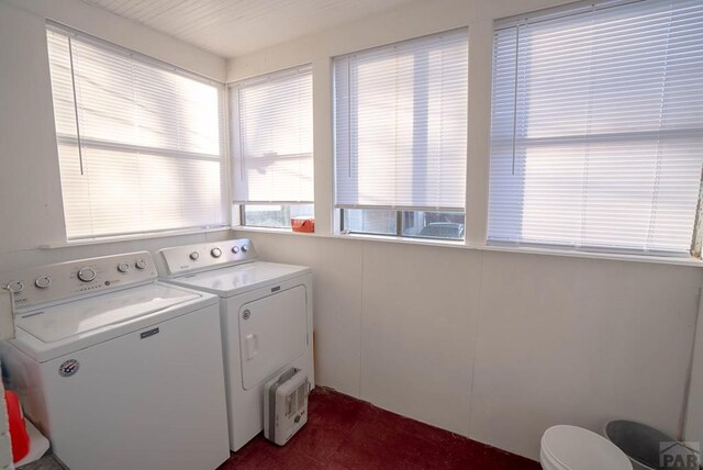 clothes washing area with laundry area and separate washer and dryer