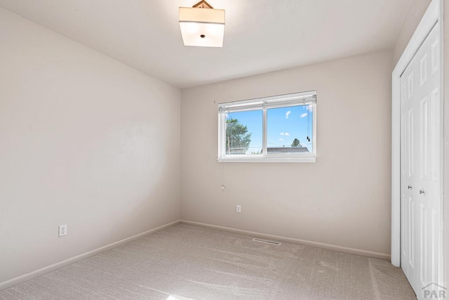3216 Baltimore Ave, Pueblo, CO 81008 - unfurnished bedroom with a closet and carpet flooring