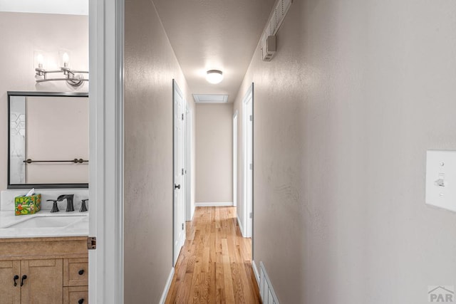 3216 Baltimore Ave, Pueblo, CO 81008 - hall featuring a sink and light wood-style flooring
