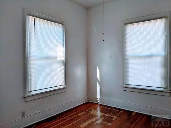 unfurnished room featuring wood finished floors