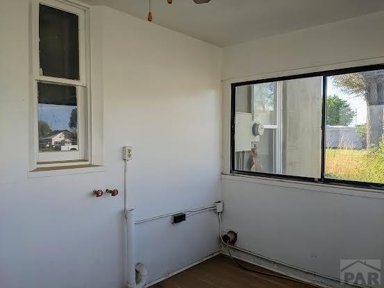 laundry room featuring dark wood finished floors