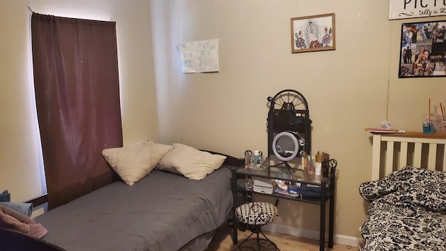 bedroom featuring baseboards