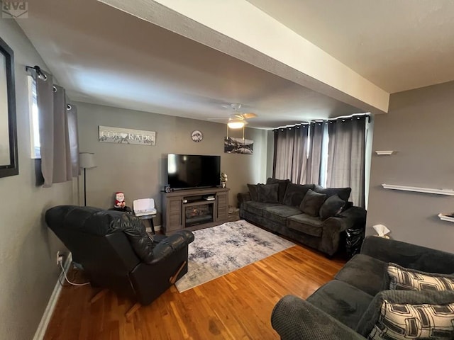 726 Morrison Ave, Pueblo, CO 81005 - living area featuring wood finished floors, a ceiling fan, and baseboards