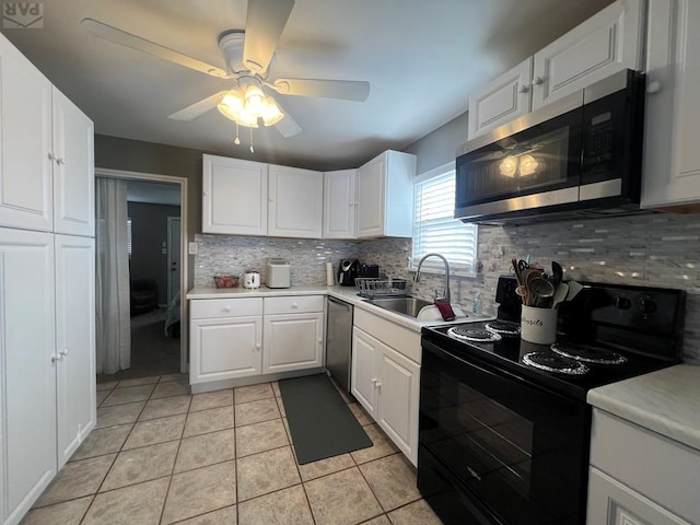 726 Morrison Ave, Pueblo, CO 81005 - kitchen with appliances with stainless steel finishes, a sink, tasteful backsplash, and white cabinetry