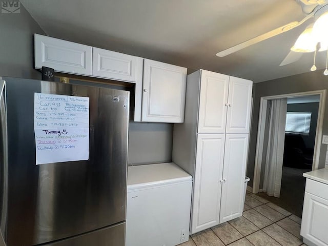 726 Morrison Ave, Pueblo, CO 81005 - kitchen featuring freestanding refrigerator, white fridge, white cabinets, light countertops, and ceiling fan