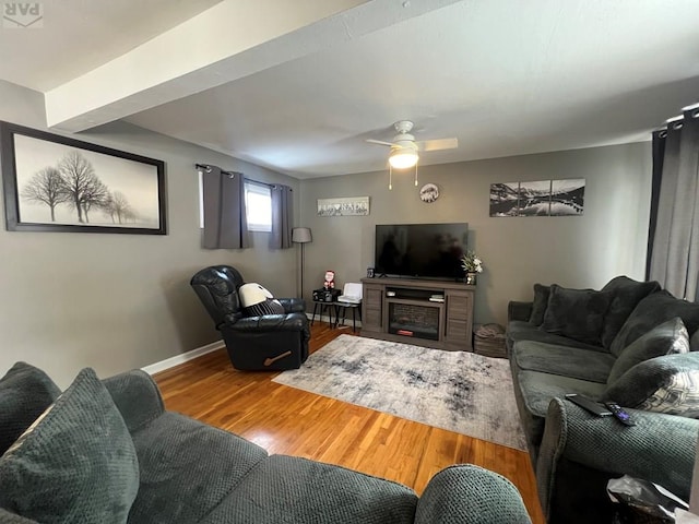 726 Morrison Ave, Pueblo, CO 81005 - living room featuring wood finished floors, a ceiling fan, and baseboards
