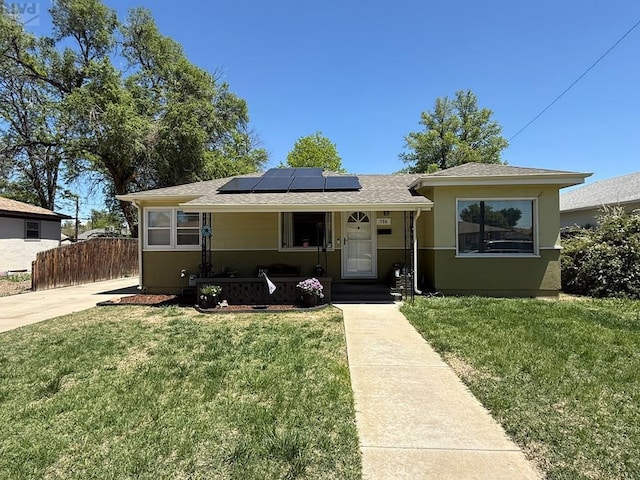 726 Morrison Ave, Pueblo, CO 81005 - view of front of home with solar panels and stucco siding