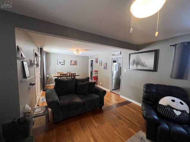 726 Morrison Ave, Pueblo, CO 81005 - living area featuring wood finished floors, baseboards, and a ceiling fan