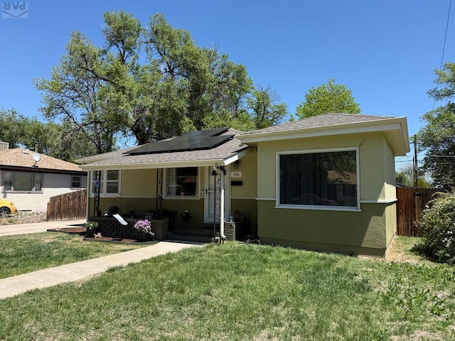 726 Morrison Ave, Pueblo, CO 81005 - bungalow-style house with solar panels and a shingled roof