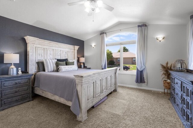 bedroom featuring vaulted ceiling, ceiling fan, light carpet, and baseboards