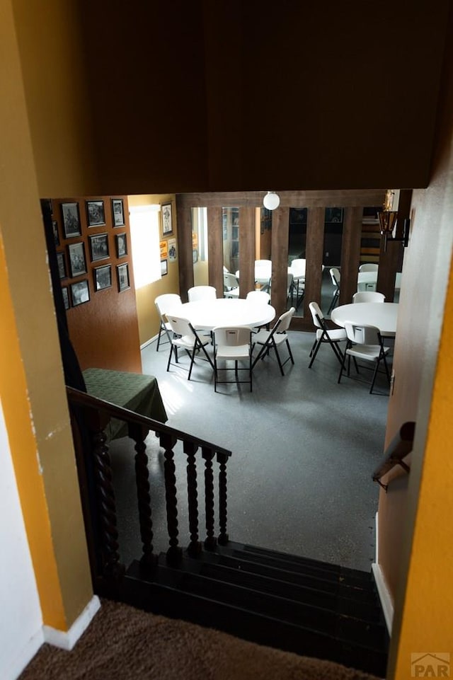 staircase with baseboards and a wealth of natural light