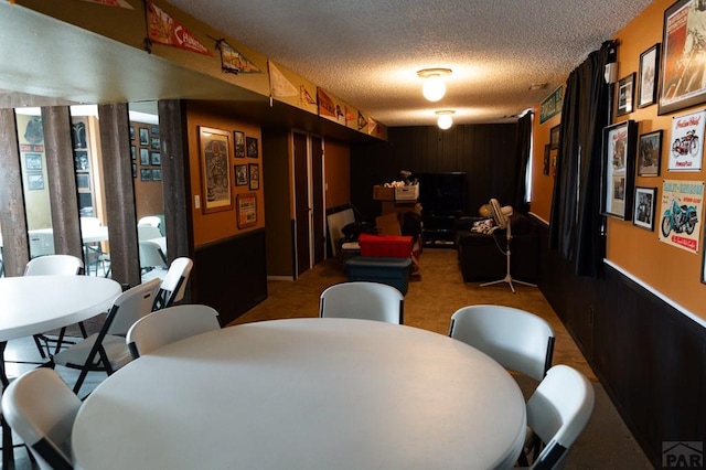 dining space with a textured ceiling