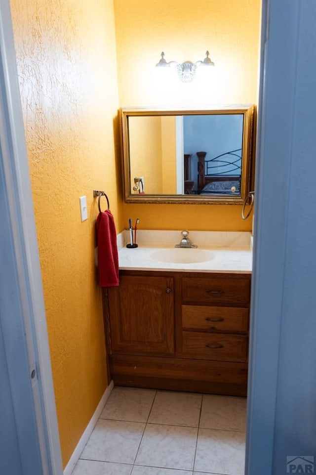 bathroom featuring vanity and tile patterned flooring