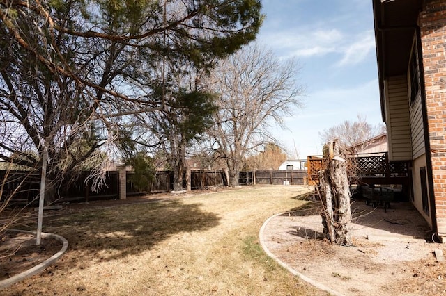 view of yard with a fenced backyard and a patio area