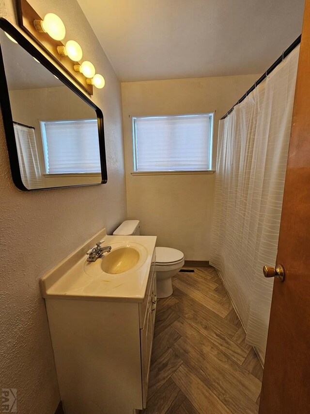 full bathroom featuring toilet and vanity