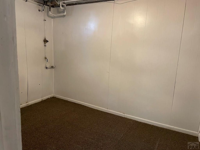 1540 E 13th St, Pueblo, CO 81001 - below grade area featuring dark colored carpet and baseboards