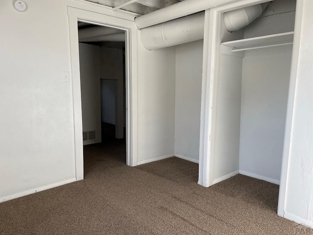1540 E 13th St, Pueblo, CO 81001 - unfurnished bedroom with carpet floors, baseboards, and a closet