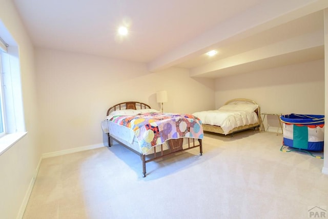 bedroom with carpet floors and baseboards