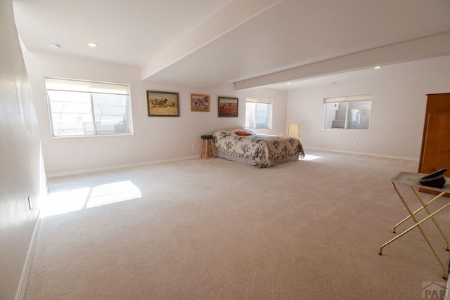bedroom featuring carpet flooring, baseboards, beam ceiling, and recessed lighting