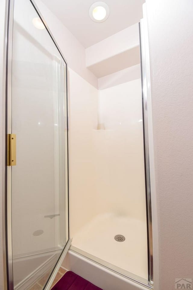 bathroom with a stall shower
