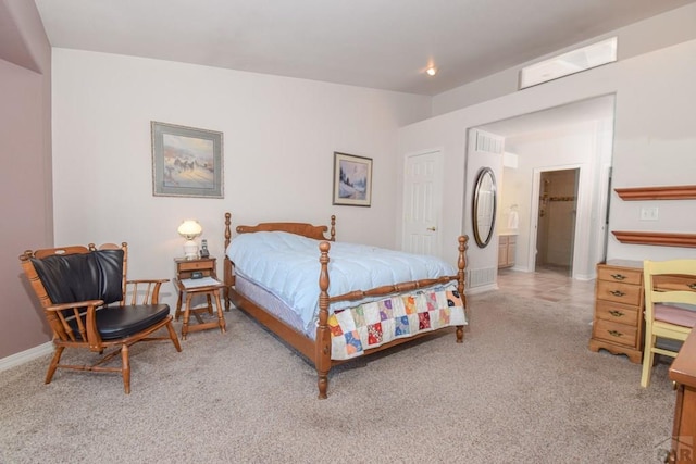 bedroom featuring carpet floors, baseboards, and connected bathroom